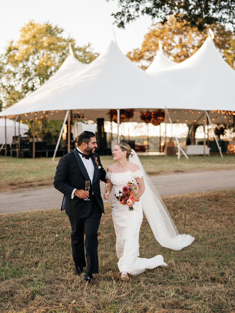 Bride and groom kissing during outdoor wedding ceremony