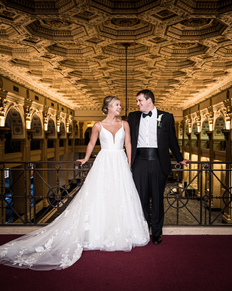 Bride and groom on balcony of The Capital on Baronne