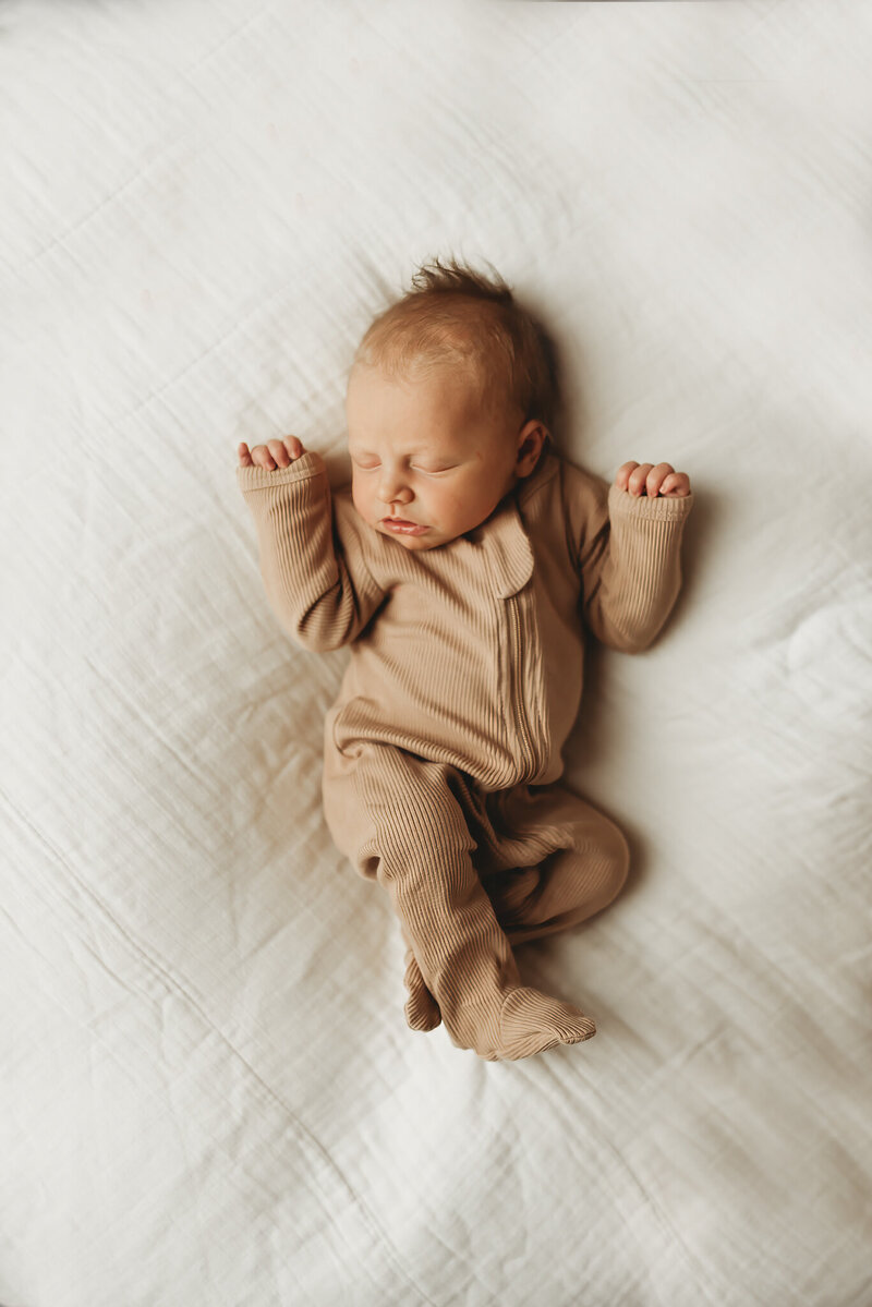 Focusing on the tiny lip details, a studio newborn session gives mommas treasured keepsakes to love forever.  Nikii Pix Photography is based in Bismarck, ND and specializes in newborn sessions. 