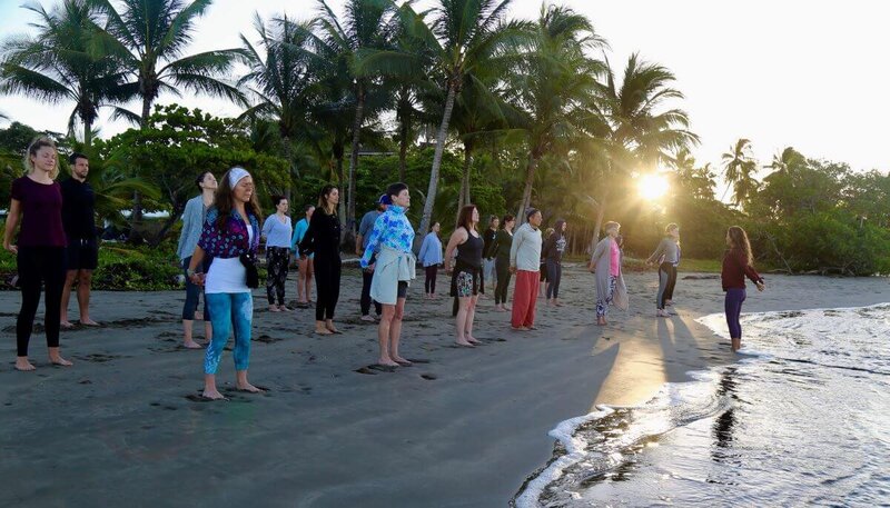 Beautiful beach yoga class in paradise during morning yoga training in Costa Rica