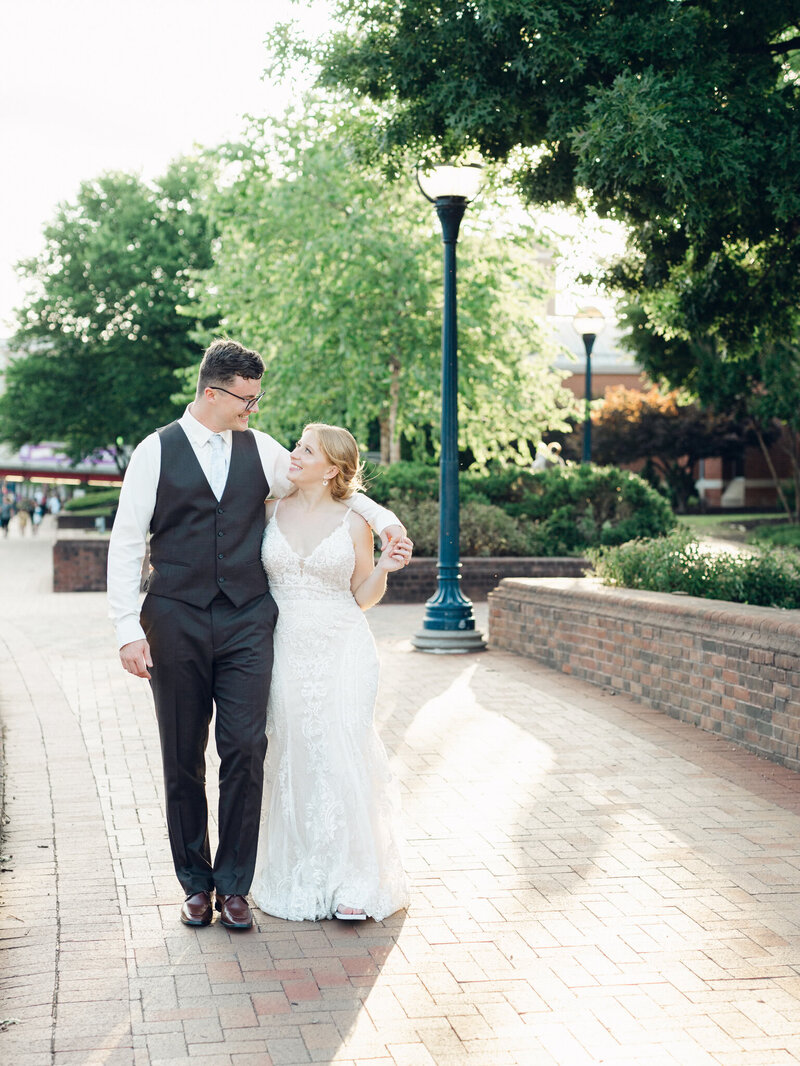 Couple with arms around each other walking taken by wedding photographers in Frederick MD