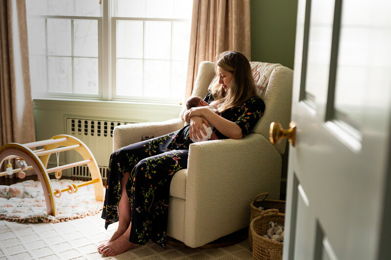 Mother Breastfeeding Newborn in Nursery in Westchester