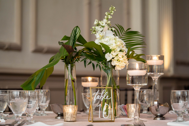 Tea lights and flowers on a table at a wedding venue