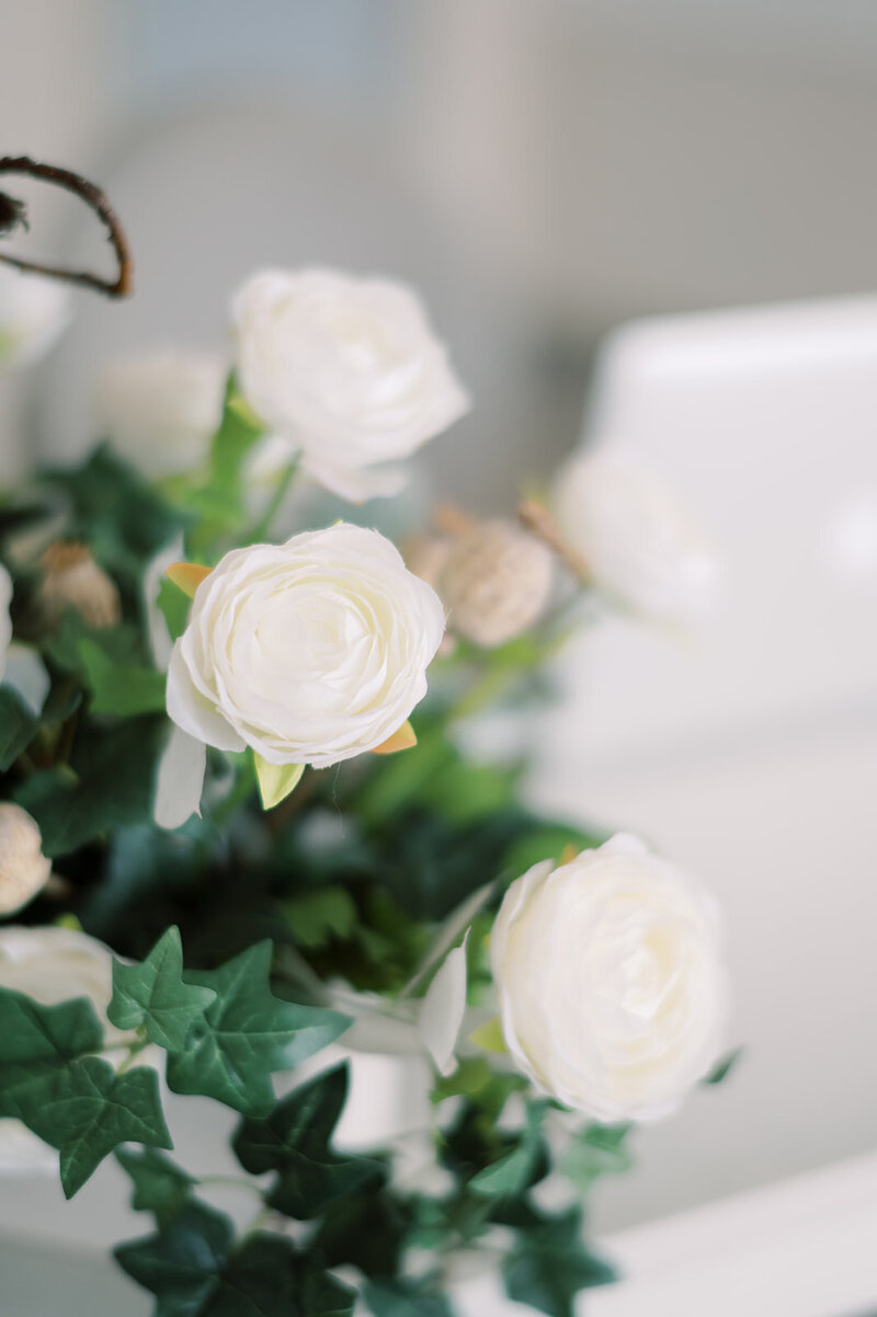 a white and green floral arrangement,