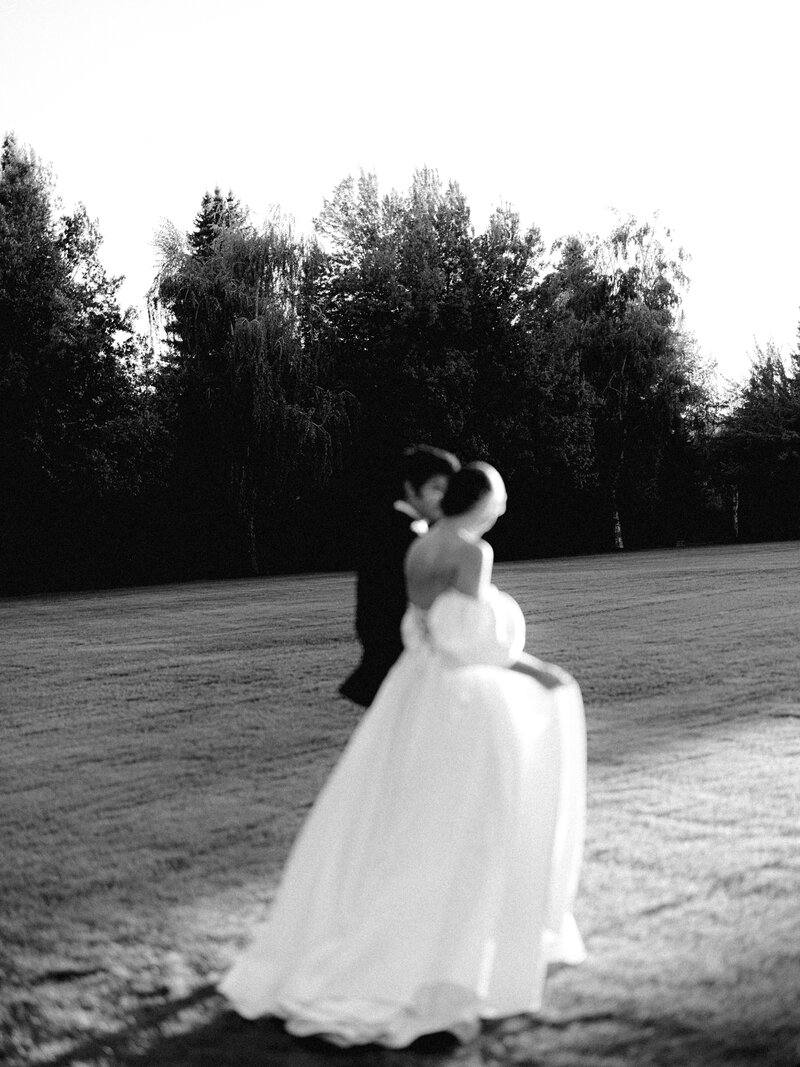 bride and groom walking the grounds at oakshire estate