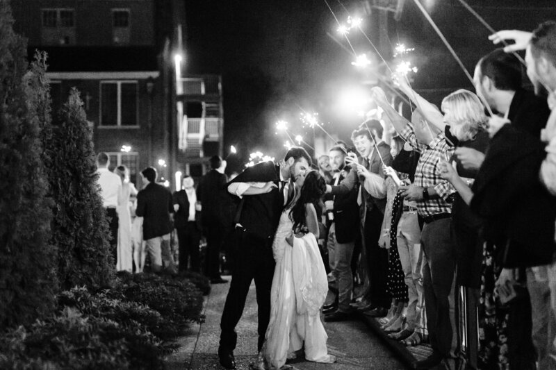 Bride and groom kiss during sparkler exit, winx photo knoxville wedding photographer