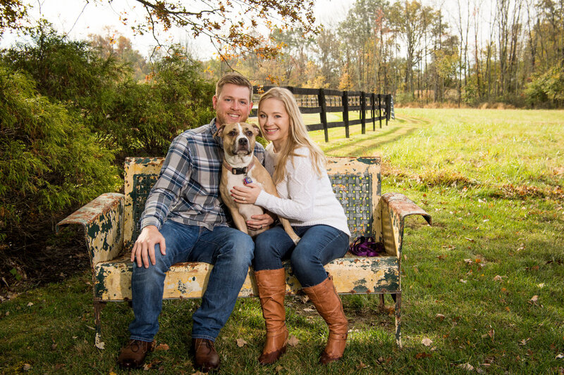 young couple with dog outdoor family session