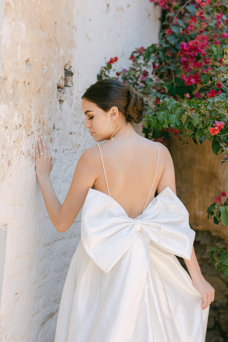 Bridal gown with bow at the Mission San Capistrano