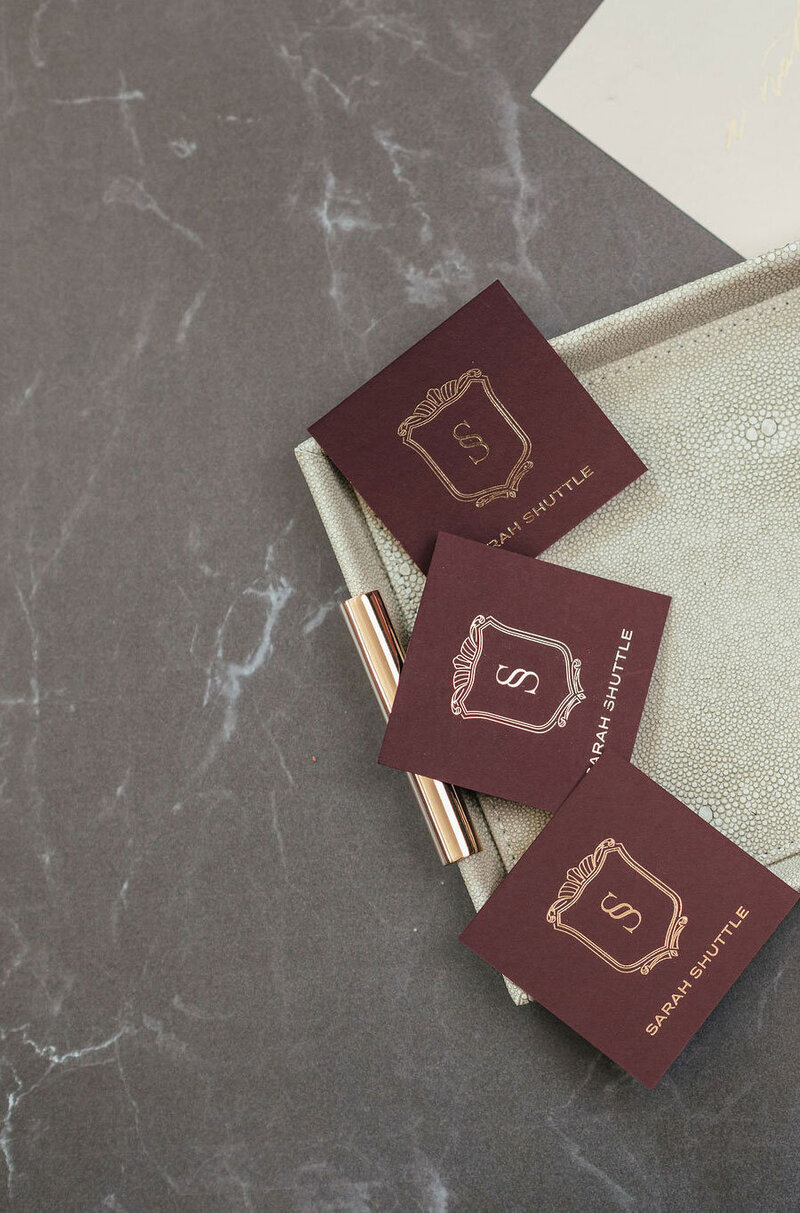 Flatlay of bespoke luxury business cards designed by Sarah Shuttle, UK brand designer