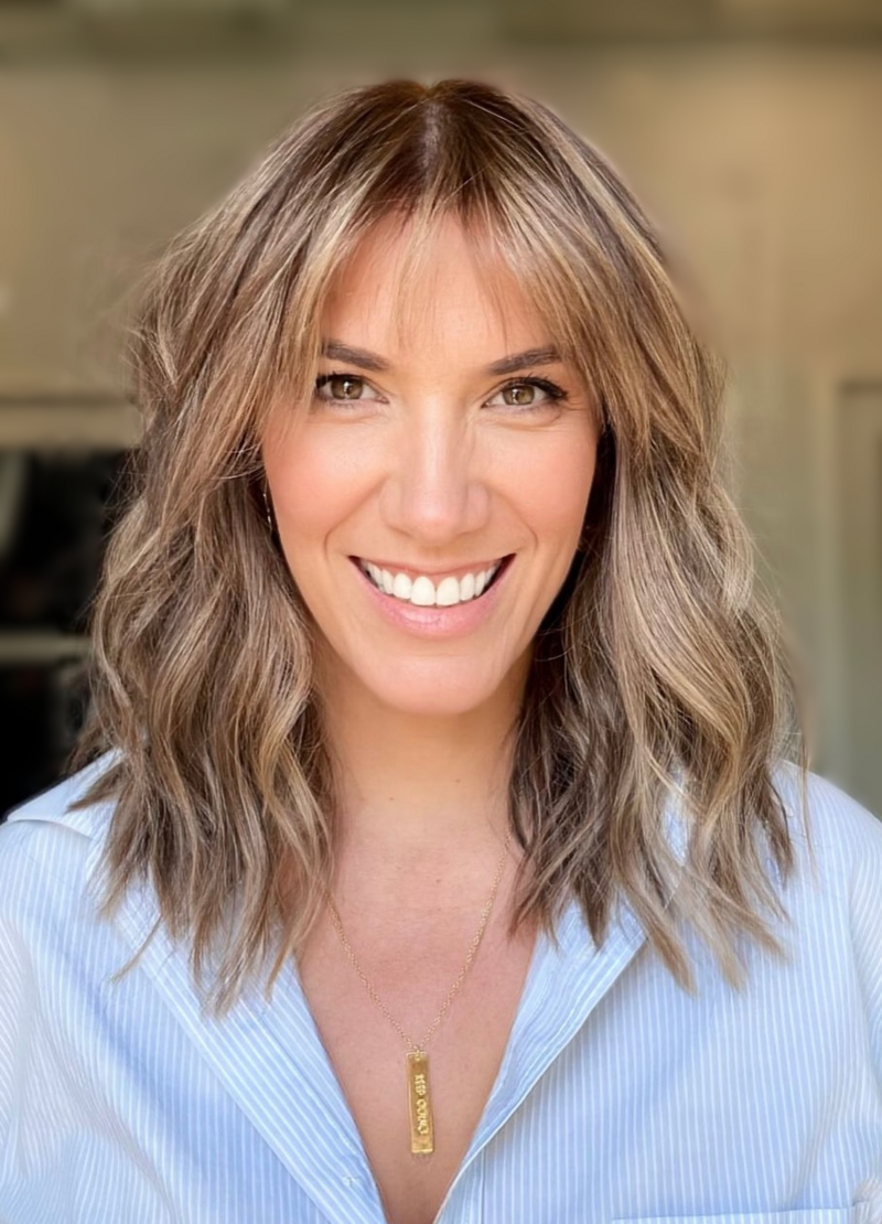 professional headshot of chasity campbell in a blue shirt smiling at the camera