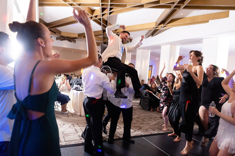 Ally and Sean-Patrick's wedding reception at Hotel Washington (formerly The W Hotel) was an absolute blast. Pictured here is just one of many times the groom or bride was paraded through the air by exuberant wedding guests, and the dancing never stopped.