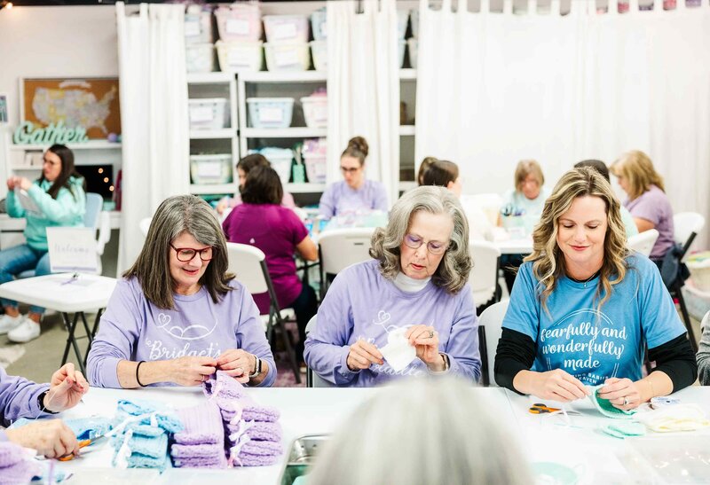 volunteers sew for pregnancy and infant loss