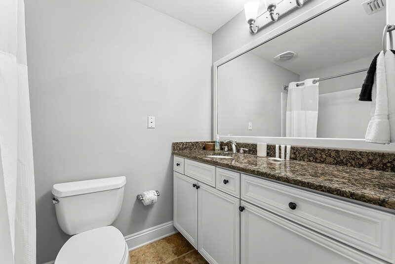 bathroom vanity with granite countertop