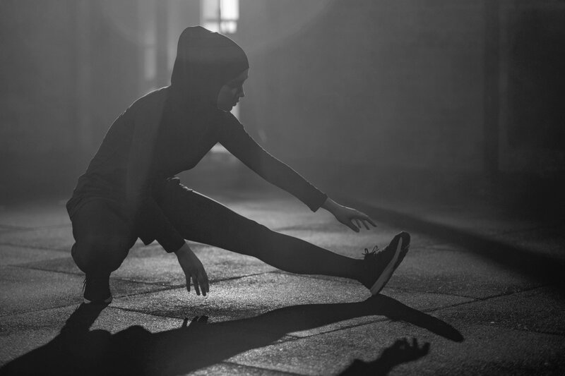 woman stretching in gym