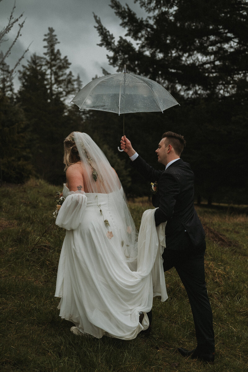 Bride and groom about to kiss each other in the most stunning PNW, Oregon Coast. 