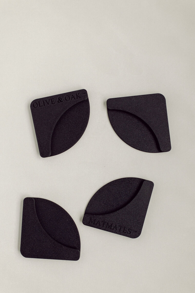 Mat Mates used to hold down styling mat corners for stable flat lay photography