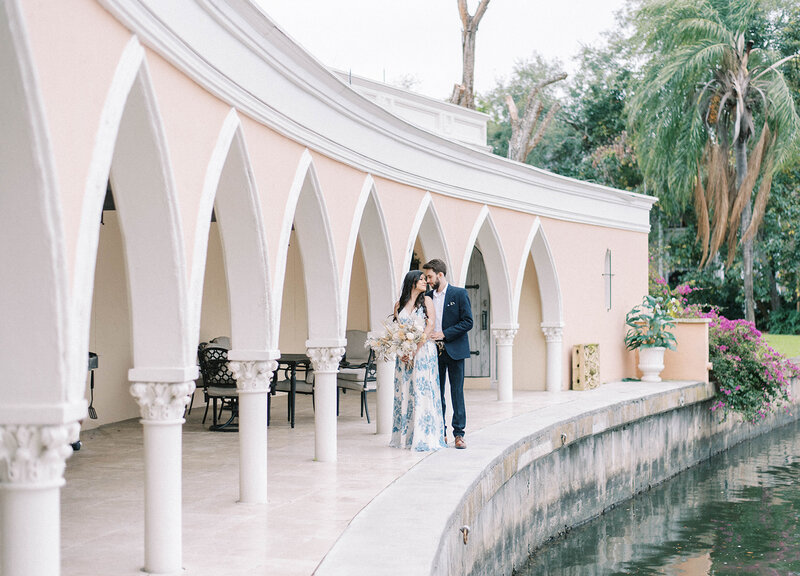 newly engaged couple hugging during outdoor engagement session at The Mirasol