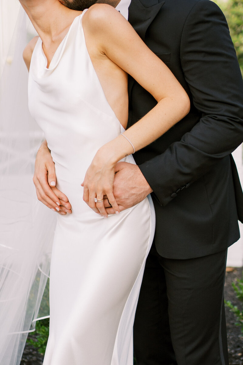 Bride and groom with their arms around each other