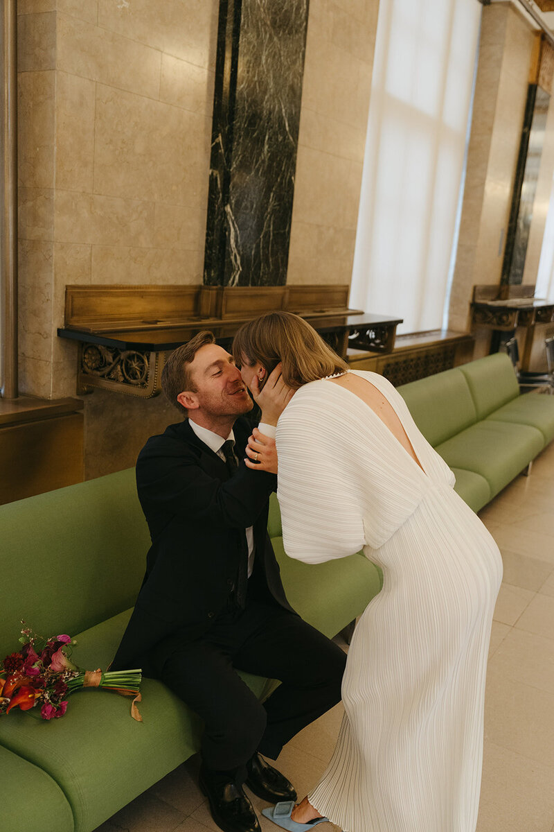 bride and groom kissing at city hall before elopement ceremony shot by Elsie Goodman Photography | NYC Elopement Packages