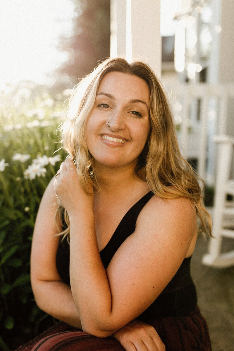 Portrait of Meg in front of pink flower wall