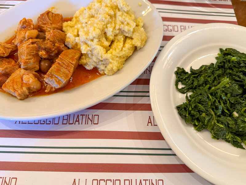 Pork with polenta and greens at Locando Buatino in Lucca, Italy
