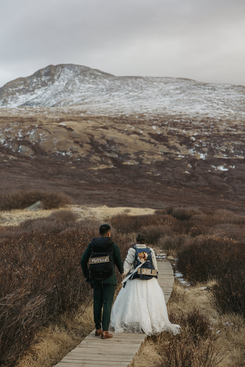 Elopement couple walking in the mountains of Ouray, Colorado during summer