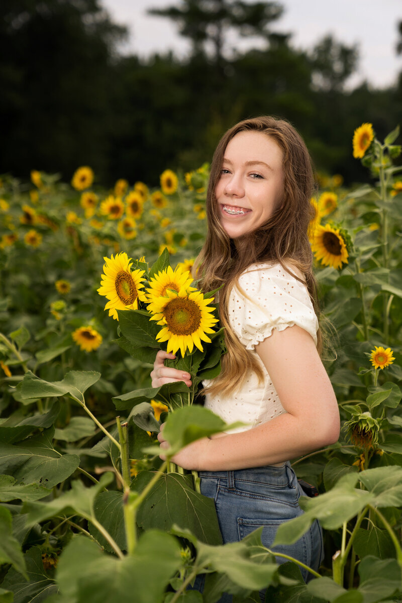 Senior in Sunflower field