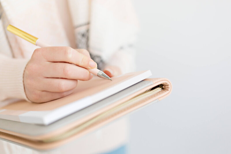 sheena writing in a journal