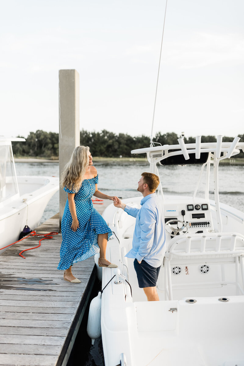 Even getting on a boat looks good in these engagement photos.