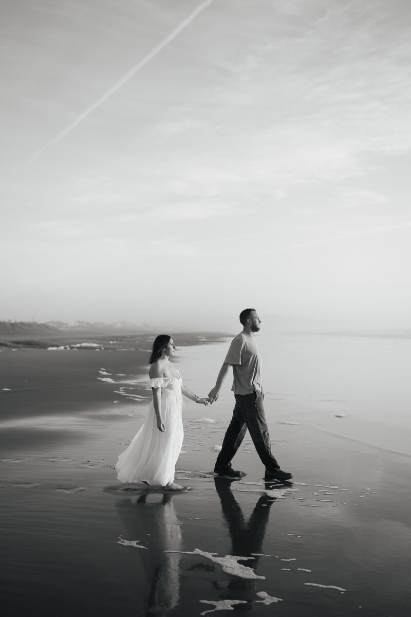 man and women holding hand walking holding hands
