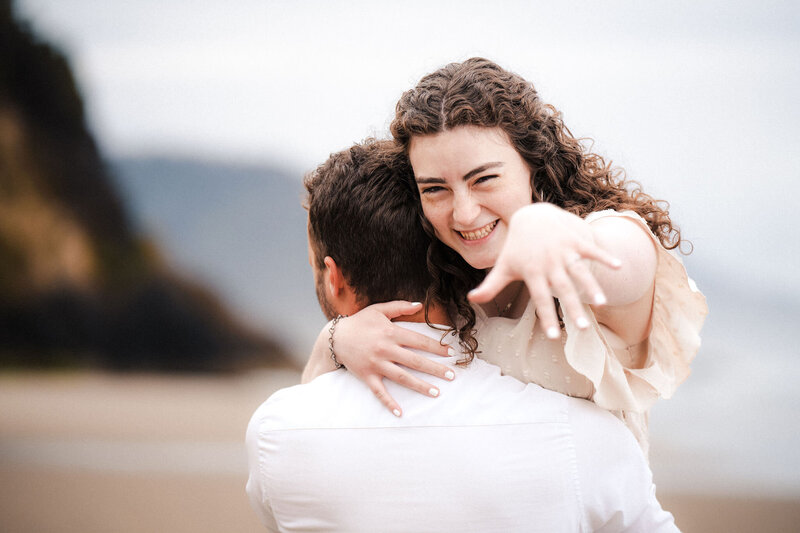 engaged woman showing off her ring