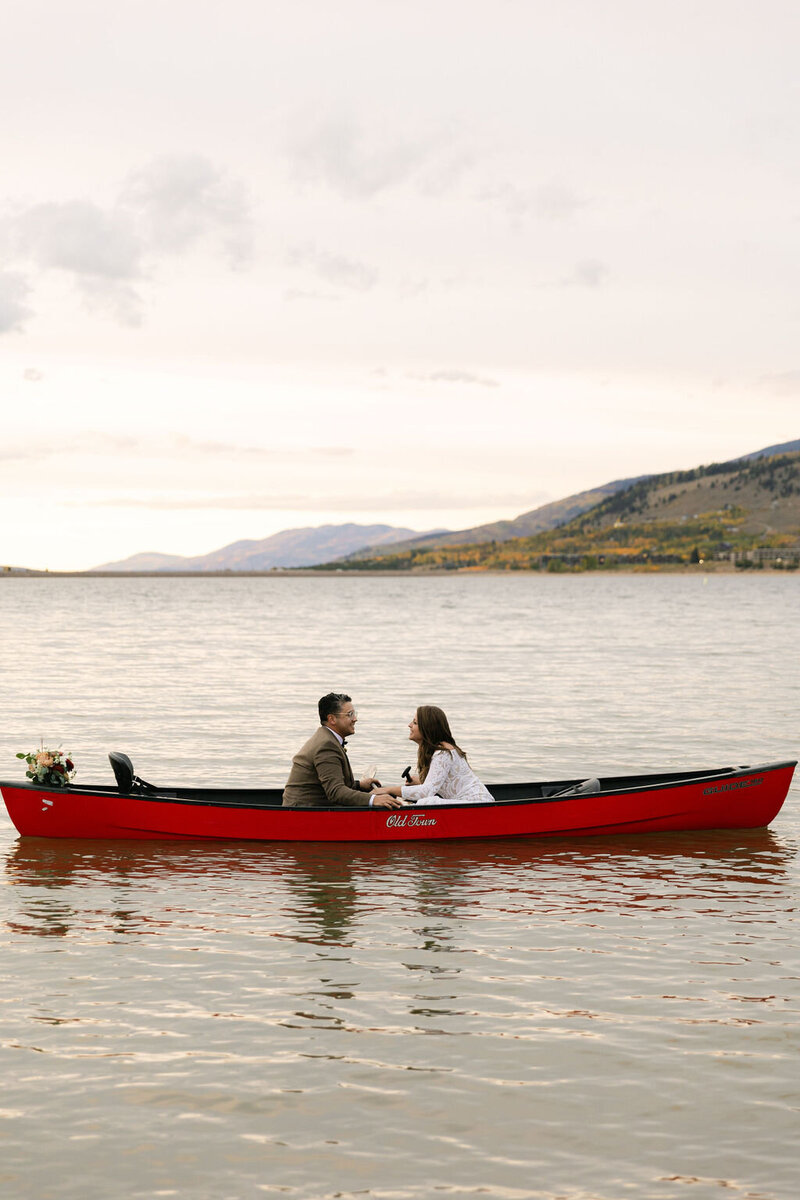 romantic sunset wedding photos in a canoe at Lake Dillon after Windy Point Campground mountain ceremony