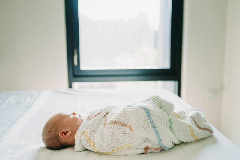 baby asleep on bed