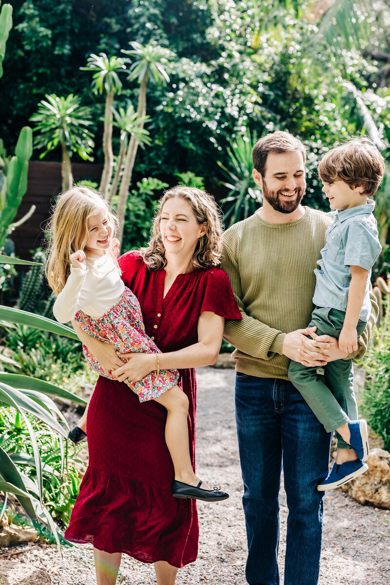 Candid moments of families by the water, enjoying holiday mini sessions at USF St. Pete.