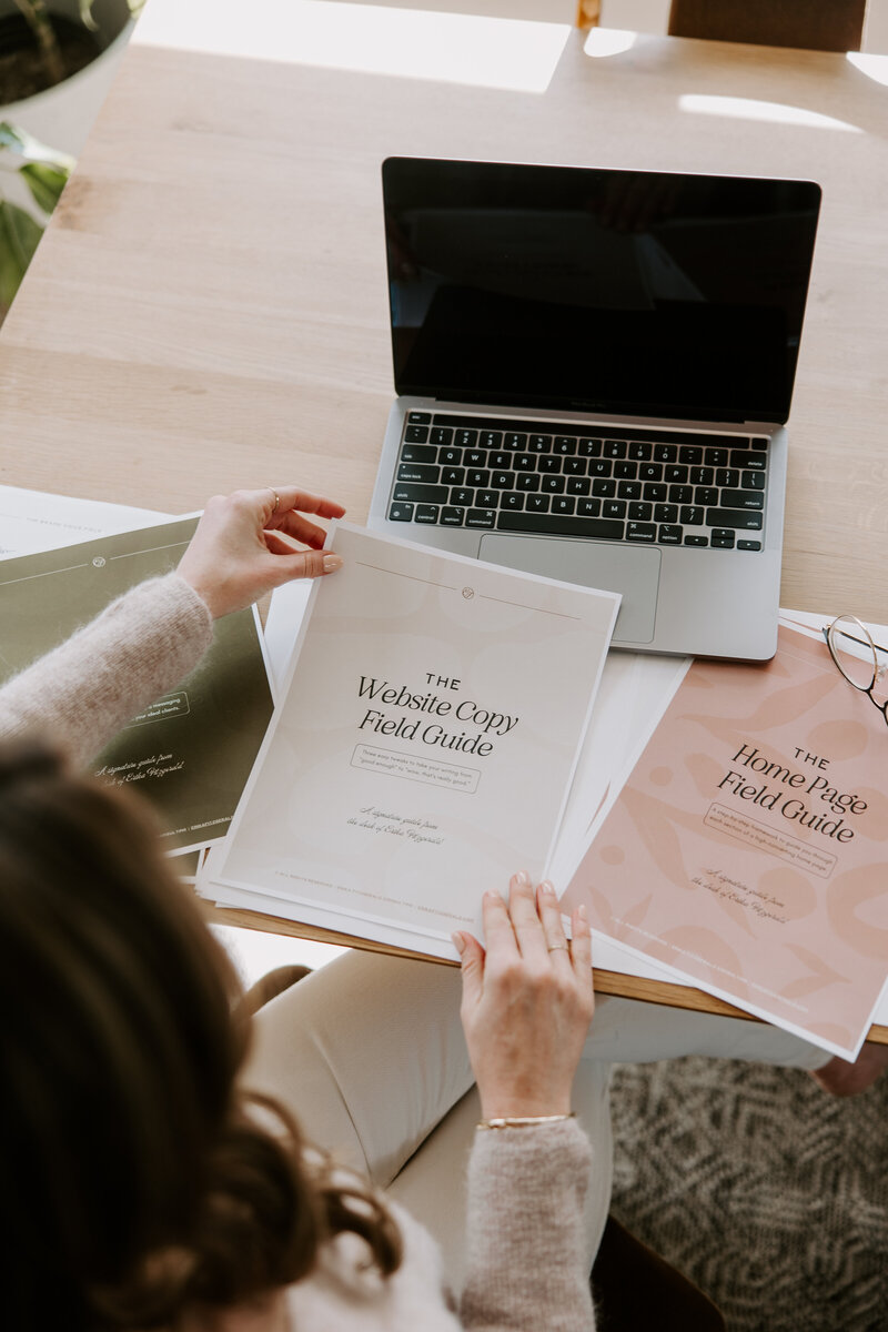 A website copywriter holding a printed website copywriting template