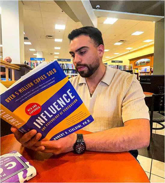 Adrian Esparza reading book