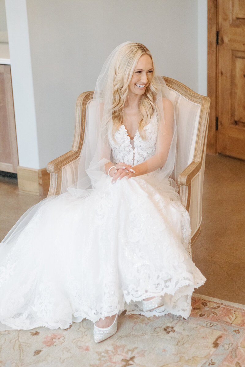 Bride getting ready in Canyonwood Ridge bridal suite with natural light and soft details