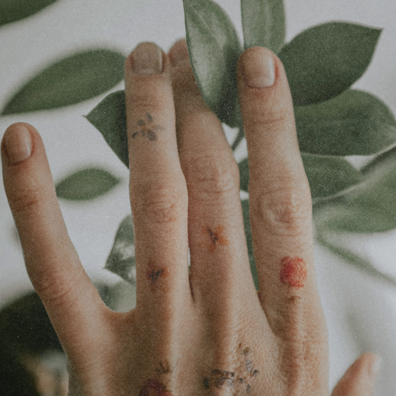 tattoo hand connecting with nature