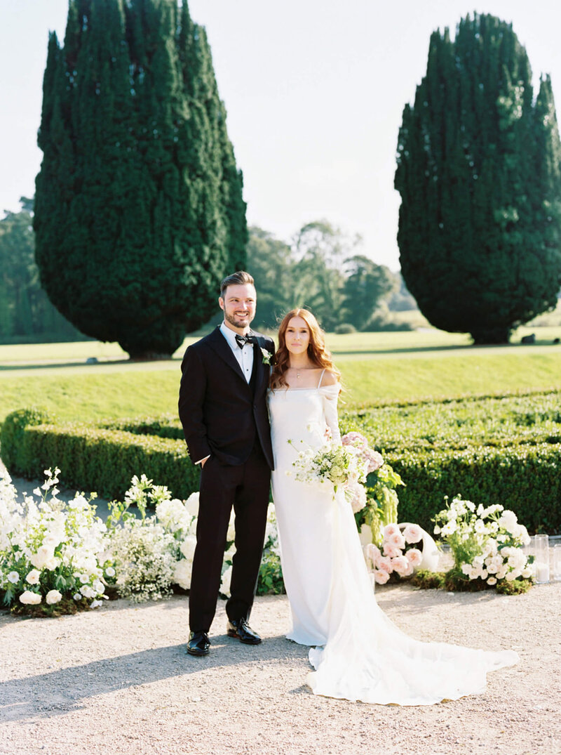 Film photo of a couple just after they got married in the gardens of Castlemartyr