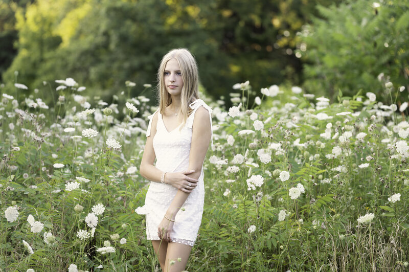 Aurora, ohio high school senior in a field of flowers with a white dress