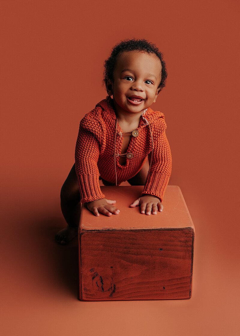 Baby making goofy expression during playful photo session