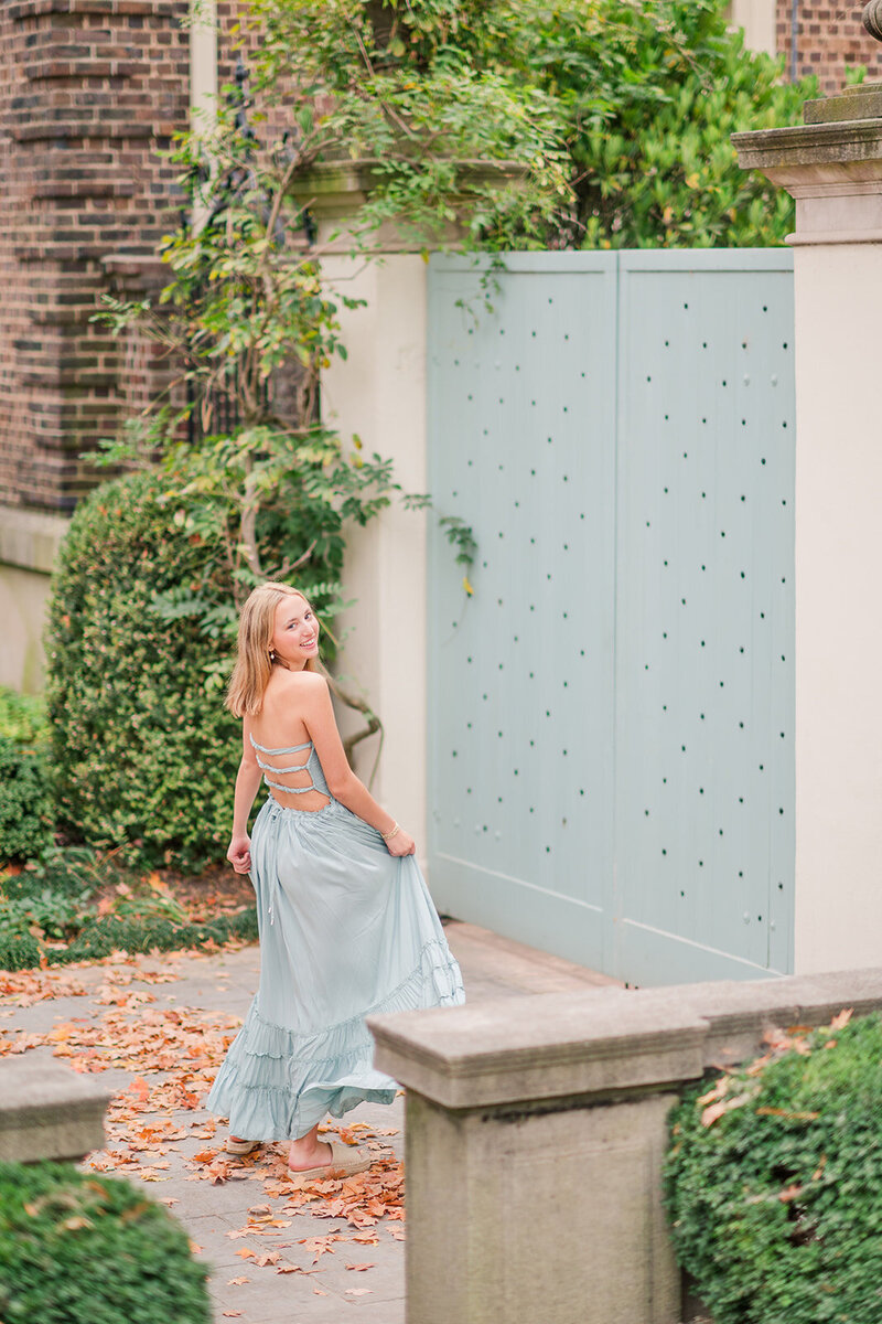 a girl posing in a blue dress