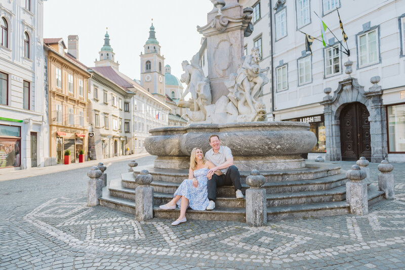 Ljubljana Slovenia Flytographer me looking at AJ by fountain 