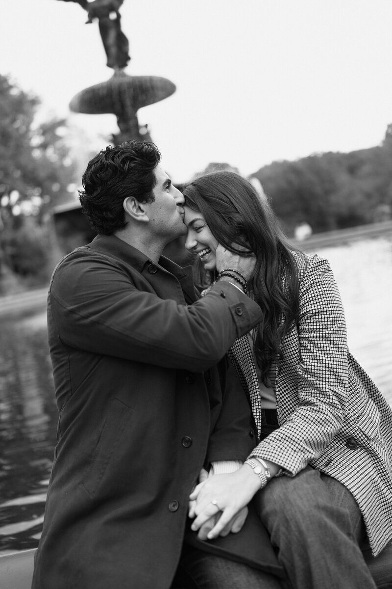 Close up of a bride with a low cowl back dress holding a dried bouquet with dainty tattoos on her arms