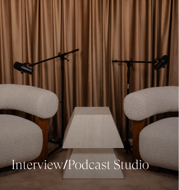 Interview and podcast studio with fun chairs and microphones.