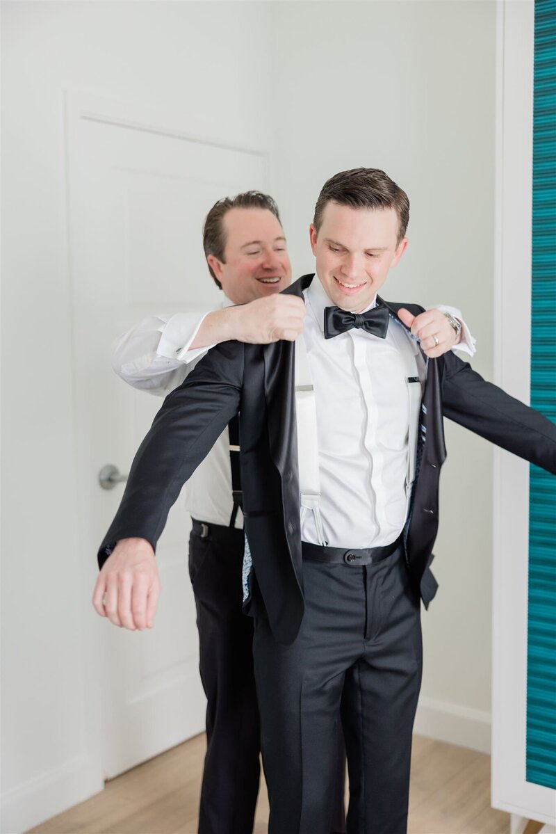 Groom getting ready with best man at the Alfond Inn