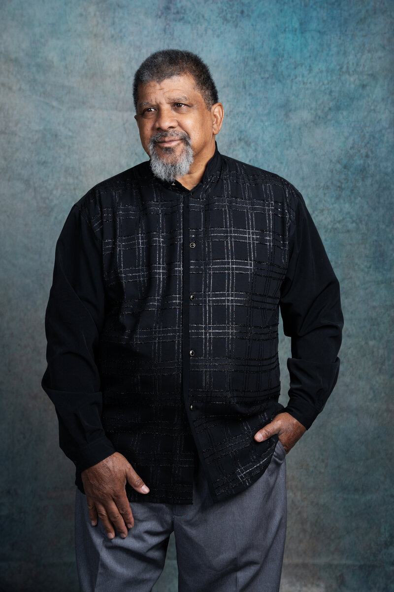 a photo of a middle aged man in a photography studio