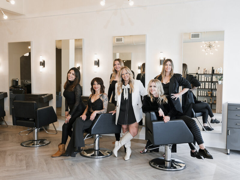 team of female hair stylists in upscale hair salon