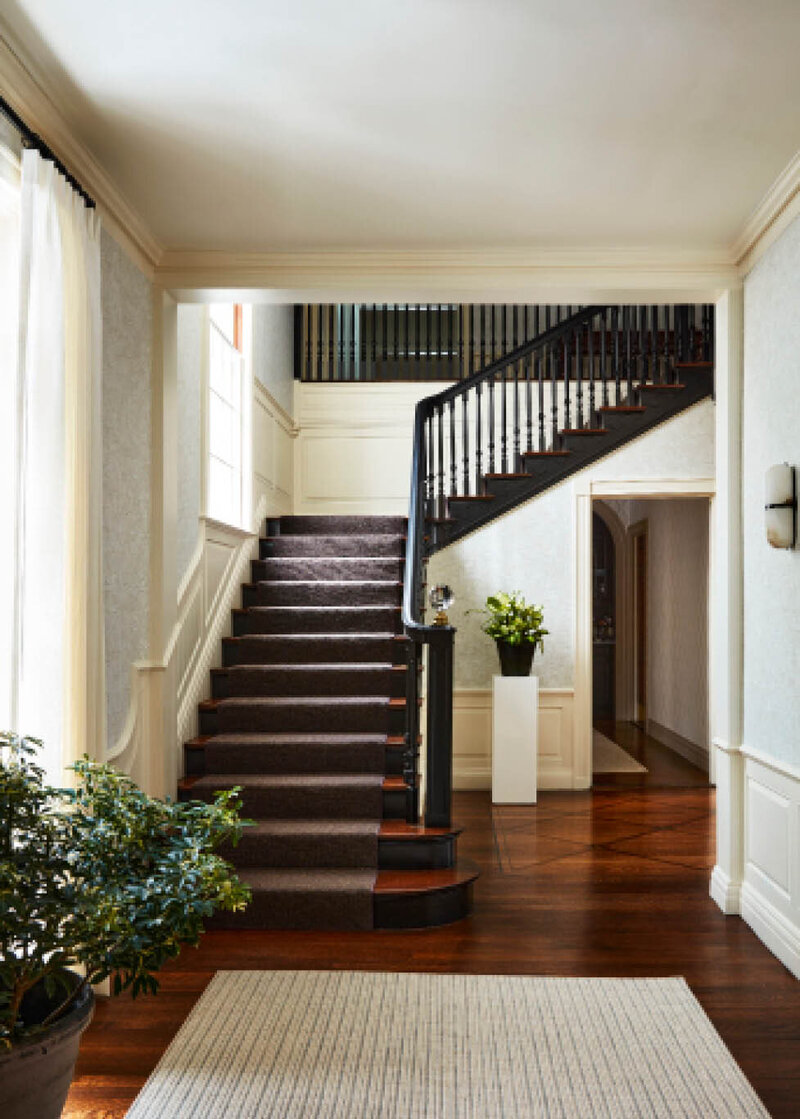 Explore the historic Concord home featuring an original grand staircase and classic architecture, redesigned by Boston interior designer Sarah Scales.