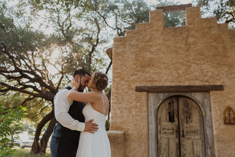 Tender Moment Between Bride and Groom at Historic Wedding Location by TLC Photography